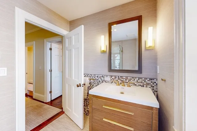 a bathroom with a sink and a mirror