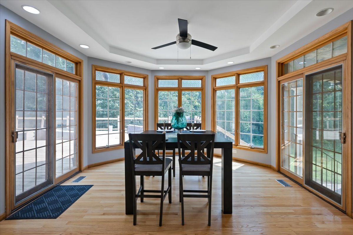 872 Rosedale Terrace Crete, IL 60417 - Photo 19 of 54 a view of a dining room with furniture window and wooden floor