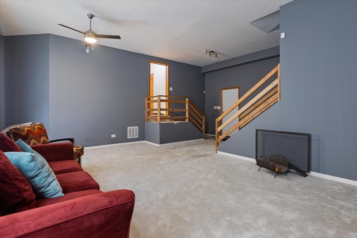 872 Rosedale Terrace Crete, IL 60417 - Photo 24 of 54 a living room with furniture and a ceiling fan