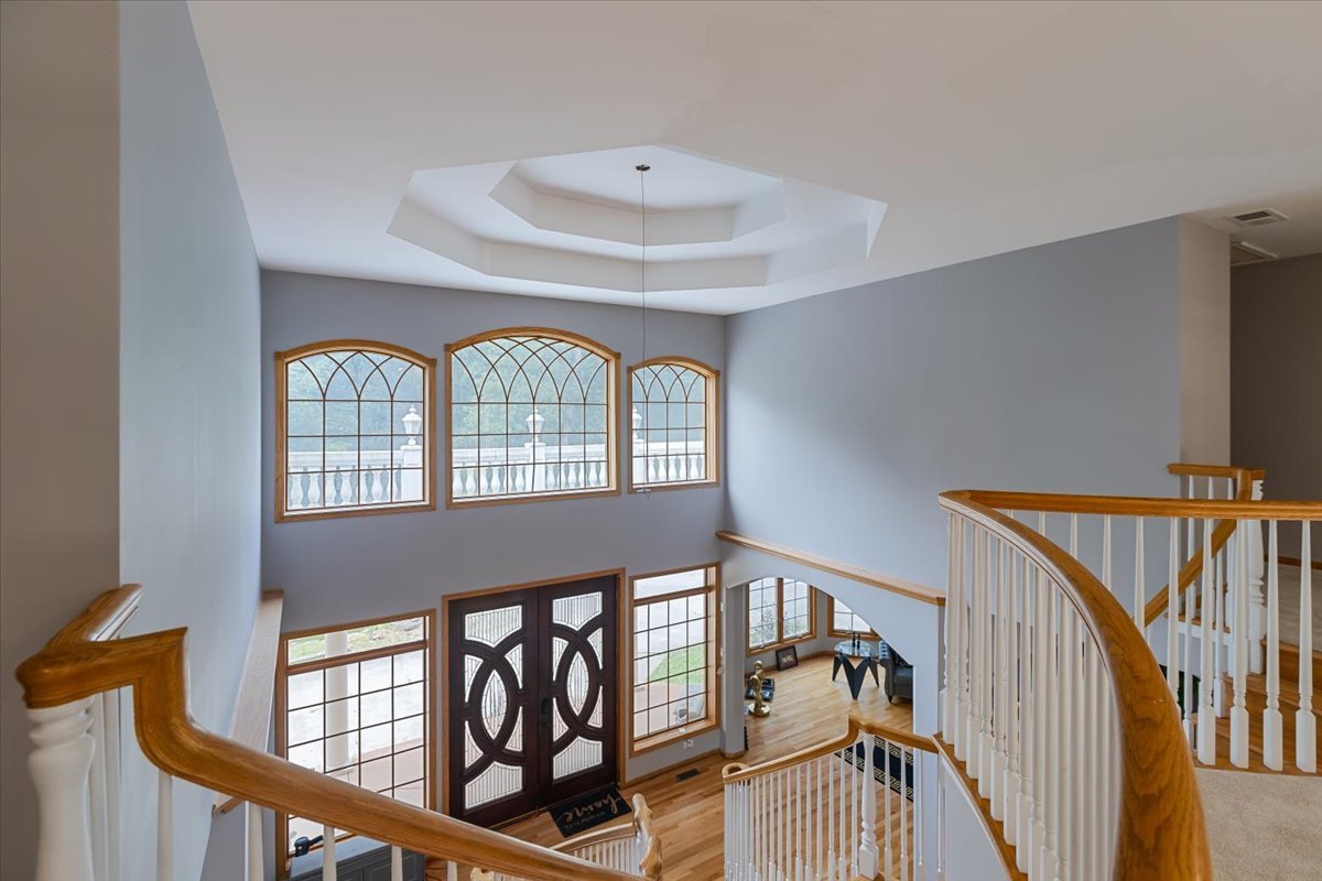 872 Rosedale Terrace Crete, IL 60417 - Photo 31 of 54 a view of staircase with railing and a chandelier