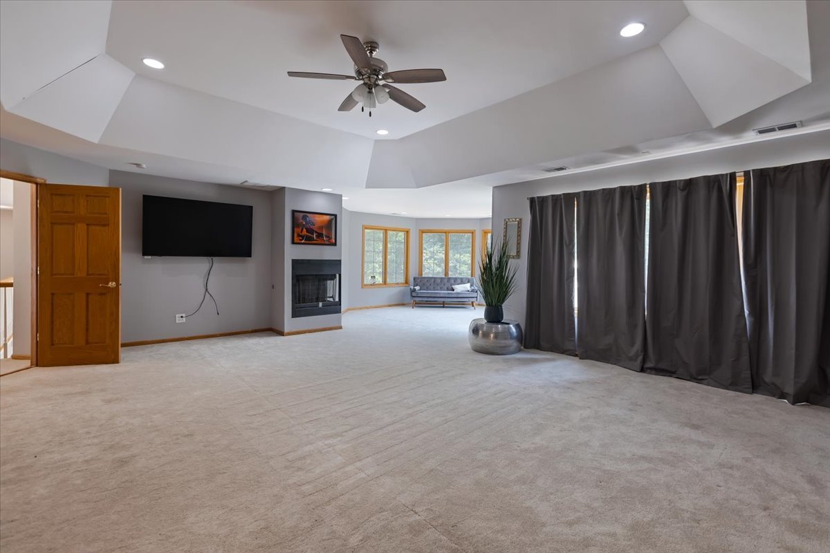 872 Rosedale Terrace Crete, IL 60417 - Photo 32 of 54 a view of a livingroom with a fireplace a ceiling fan and window