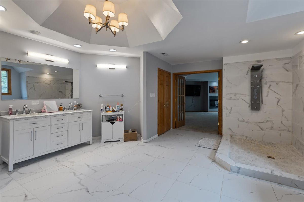 872 Rosedale Terrace Crete, IL 60417 - Photo 35 of 54 a bathroom with a double vanity sink mirror and shower