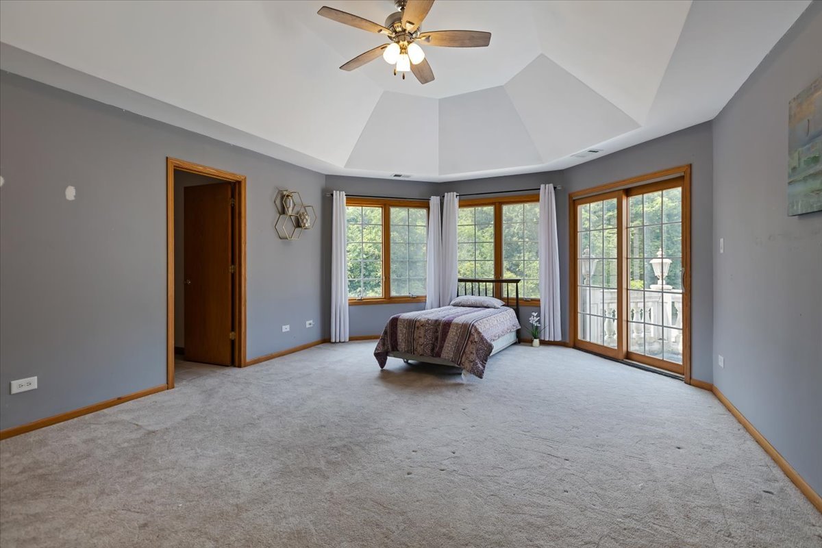 872 Rosedale Terrace Crete, IL 60417 - Photo 40 of 54 a bed sitting in a spacious bedroom next to a window