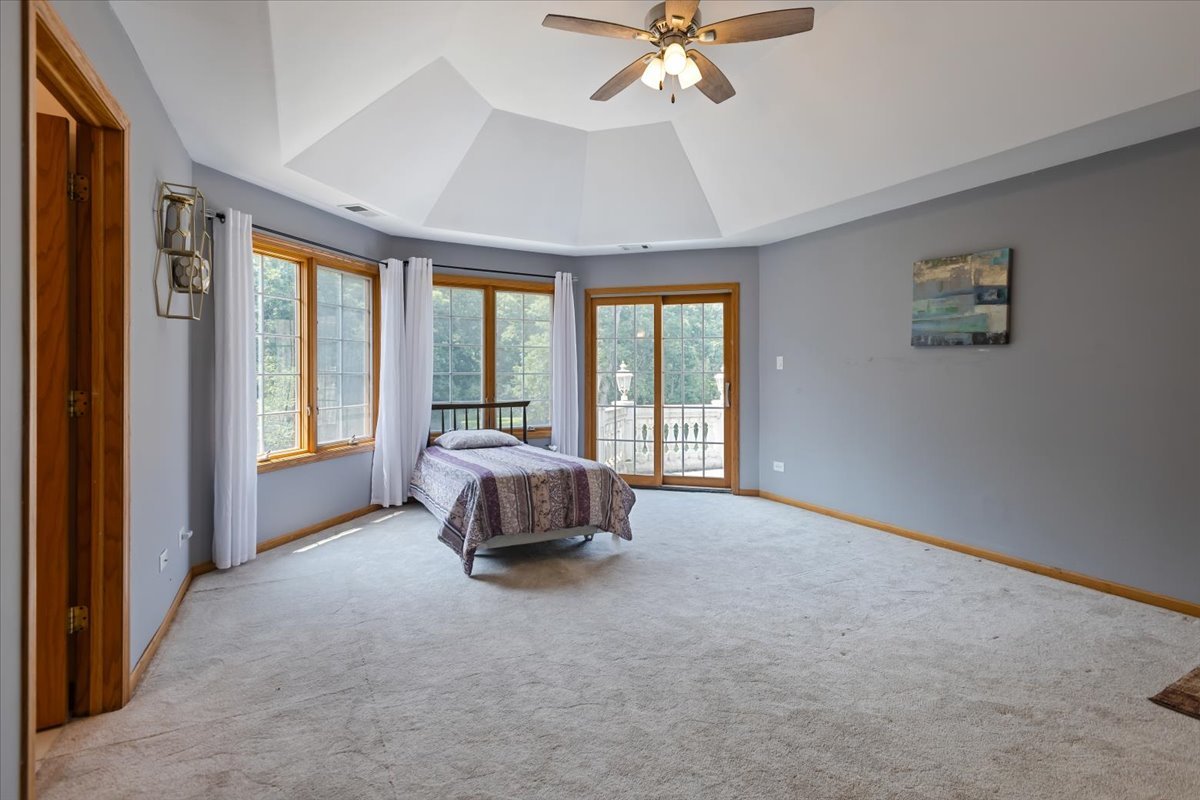872 Rosedale Terrace Crete, IL 60417 - Photo 42 of 54 a spacious bedroom with a bed and a large window