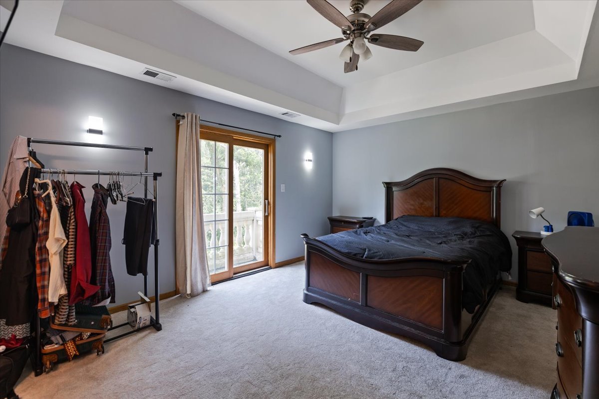 872 Rosedale Terrace Crete, IL 60417 - Photo 46 of 54 a bedroom with a bed and a ceiling fan