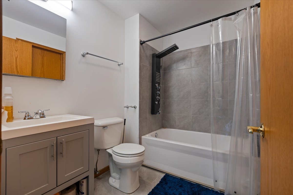 872 Rosedale Terrace Crete, IL 60417 - Photo 47 of 54 a bathroom with a granite countertop sink toilet and shower