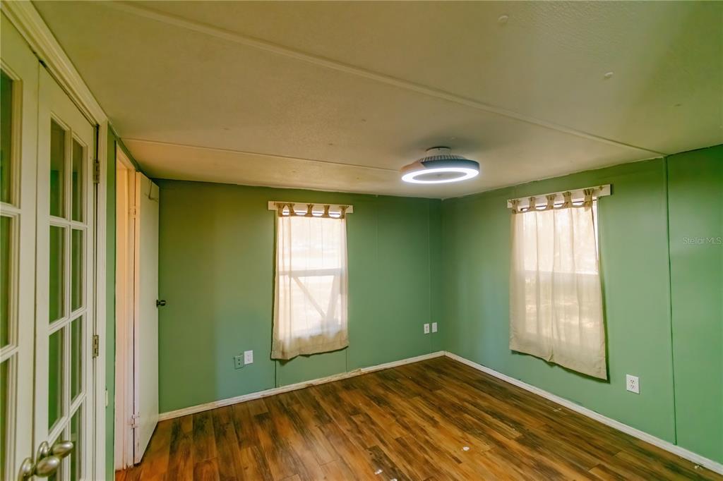 2958 Northeast 161 Place Citra, FL 32113 - Photo 11 of 26 a view of empty room with window and fan