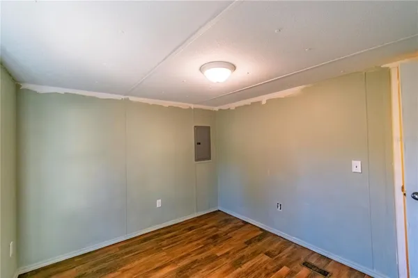 a view of room with wooden floor