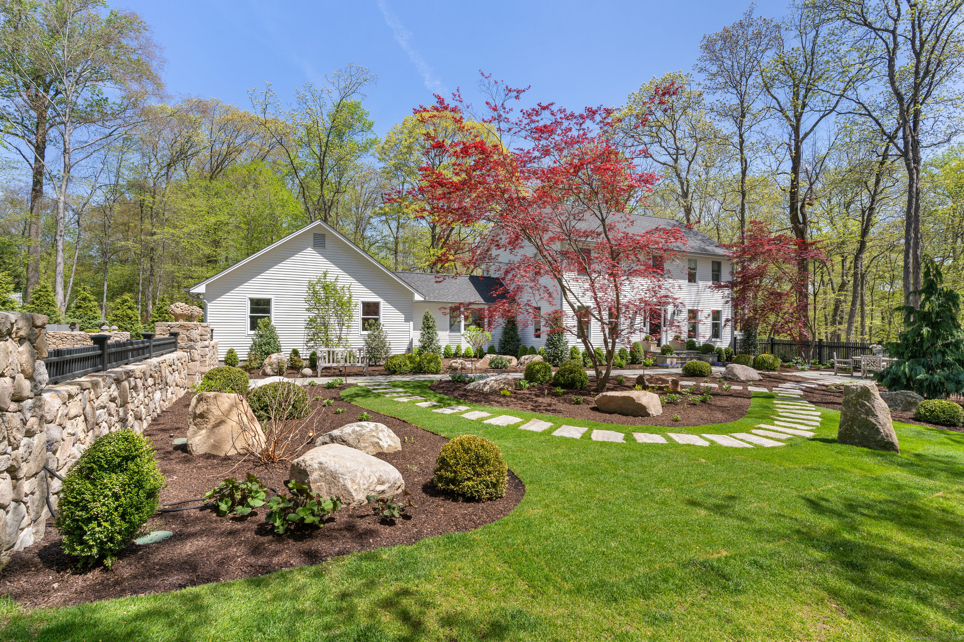 a front view of house with yard and green space