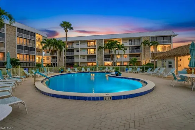 a view of a swimming pool with a patio