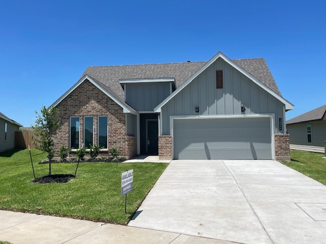 1024 Legrand Street Brenham, TX 77833 - Photo 1 of 7 a front view of a house with a yard and garage