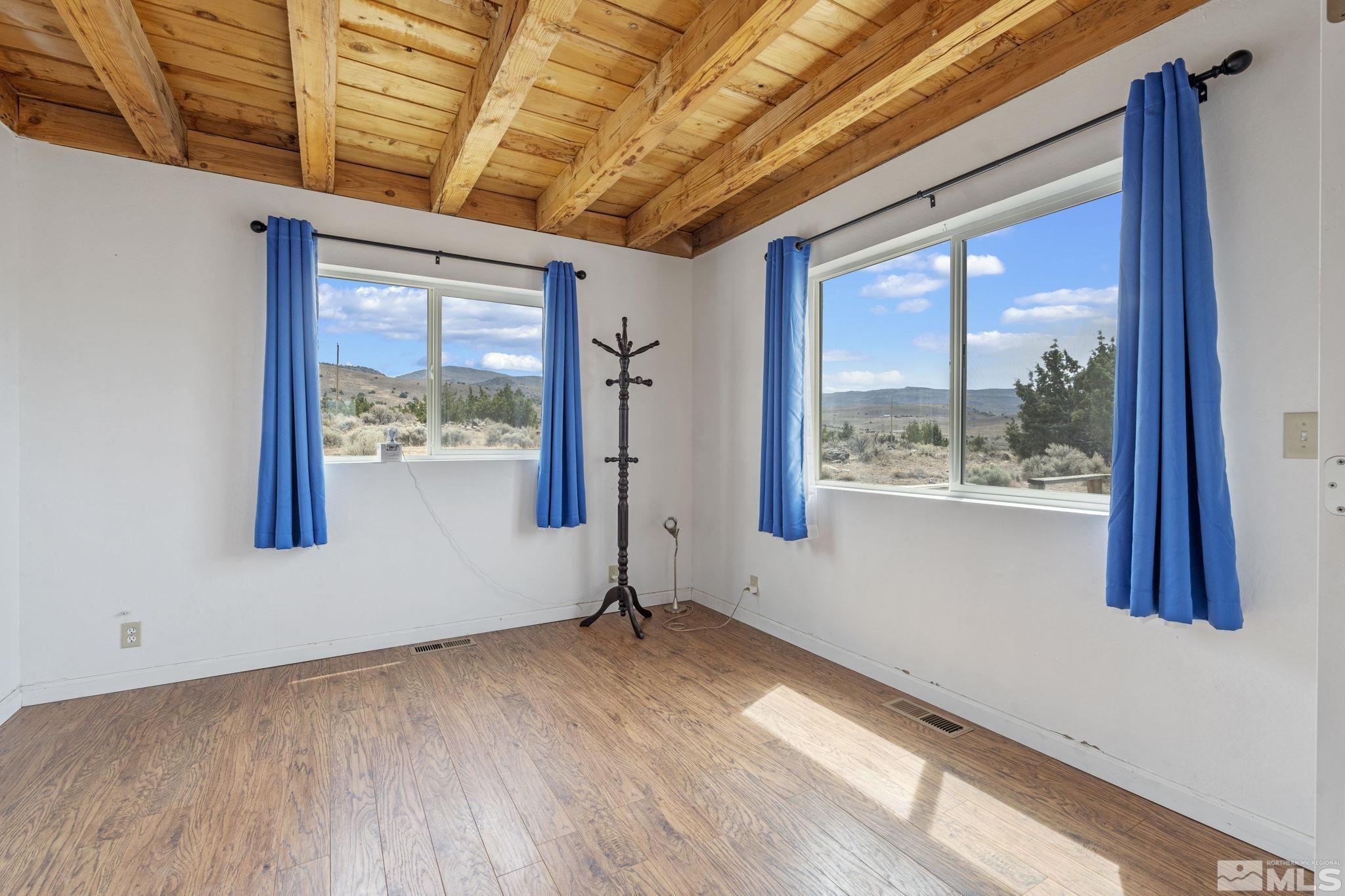 150 Red Corral Trail Reno, NV 89510 - Photo 18 of 40 a view of empty room with wooden floor and fan