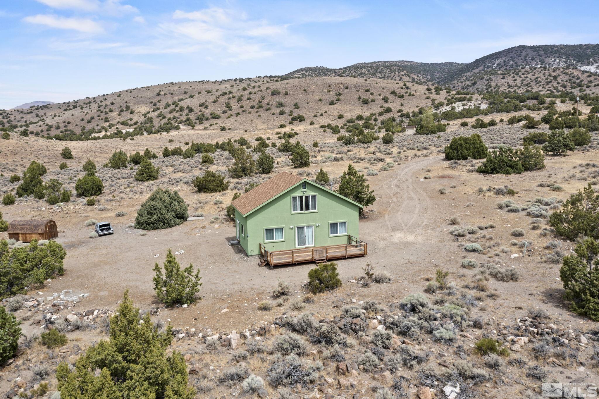 150 Red Corral Trail Reno, NV 89510 - Photo 2 of 40 a view of a field with a mountain in the background