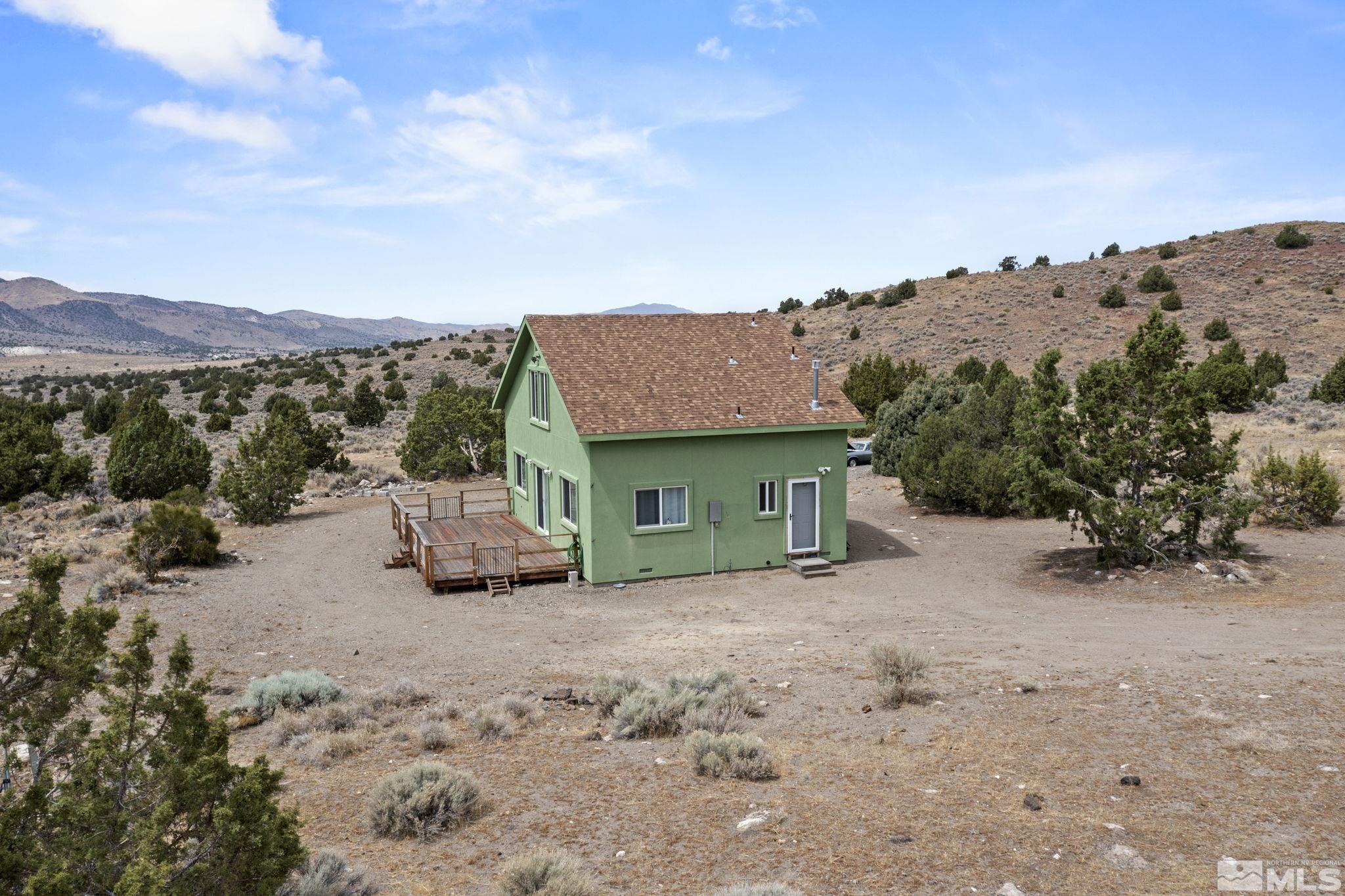 150 Red Corral Trail Reno, NV 89510 - Photo 3 of 40 a view of a house with a mountain in the background