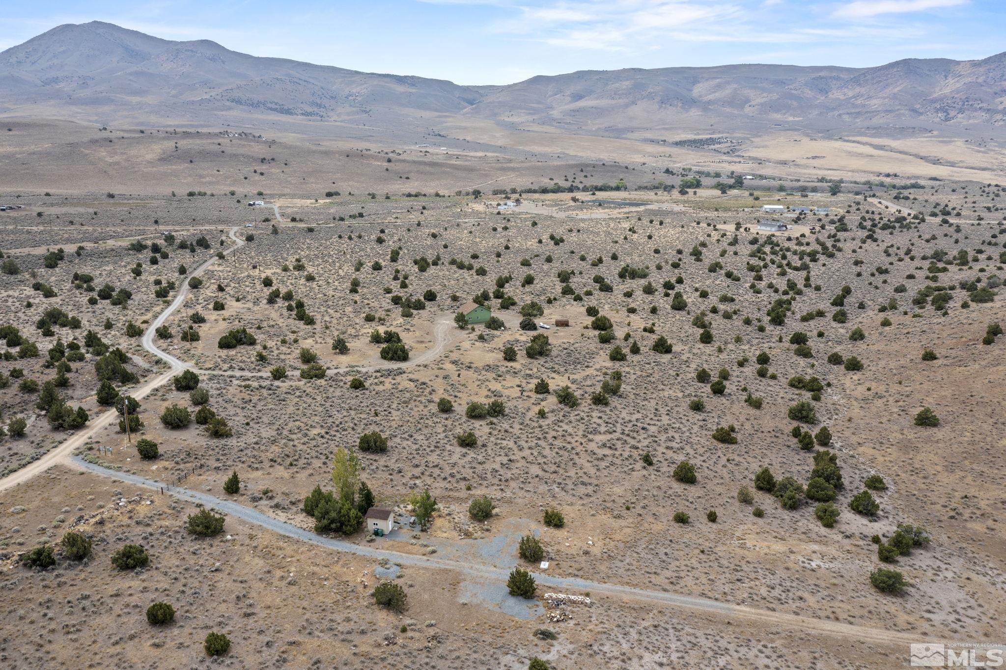150 Red Corral Trail Reno, NV 89510 - Photo 37 of 40 a view of a dry yard with mountain and trees