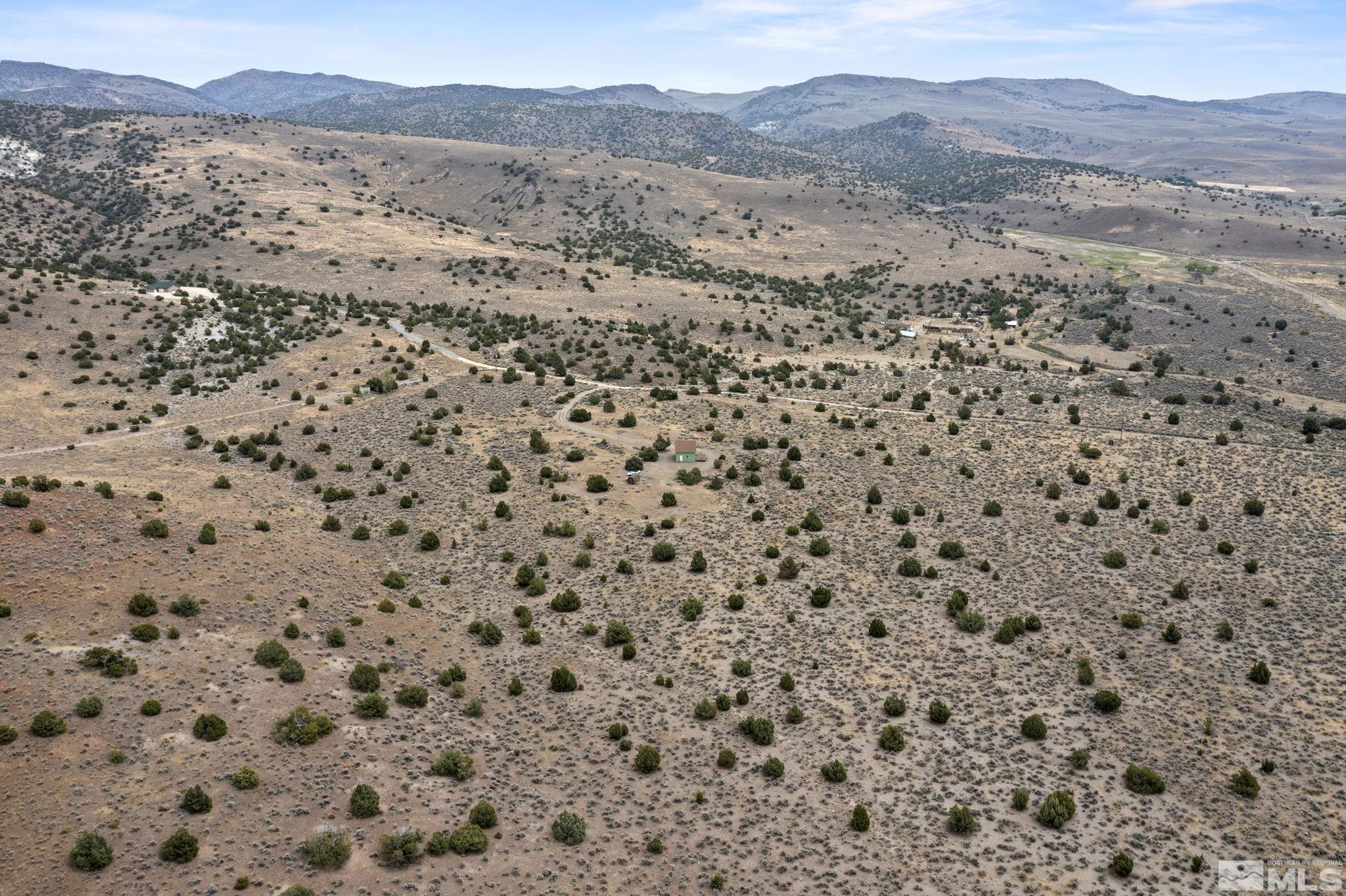 150 Red Corral Trail Reno, NV 89510 - Photo 39 of 40 a view of a dry yard with mountains and mountain view