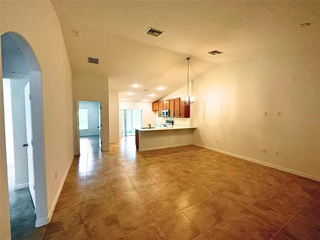 a view of a kitchen with a sink and a window