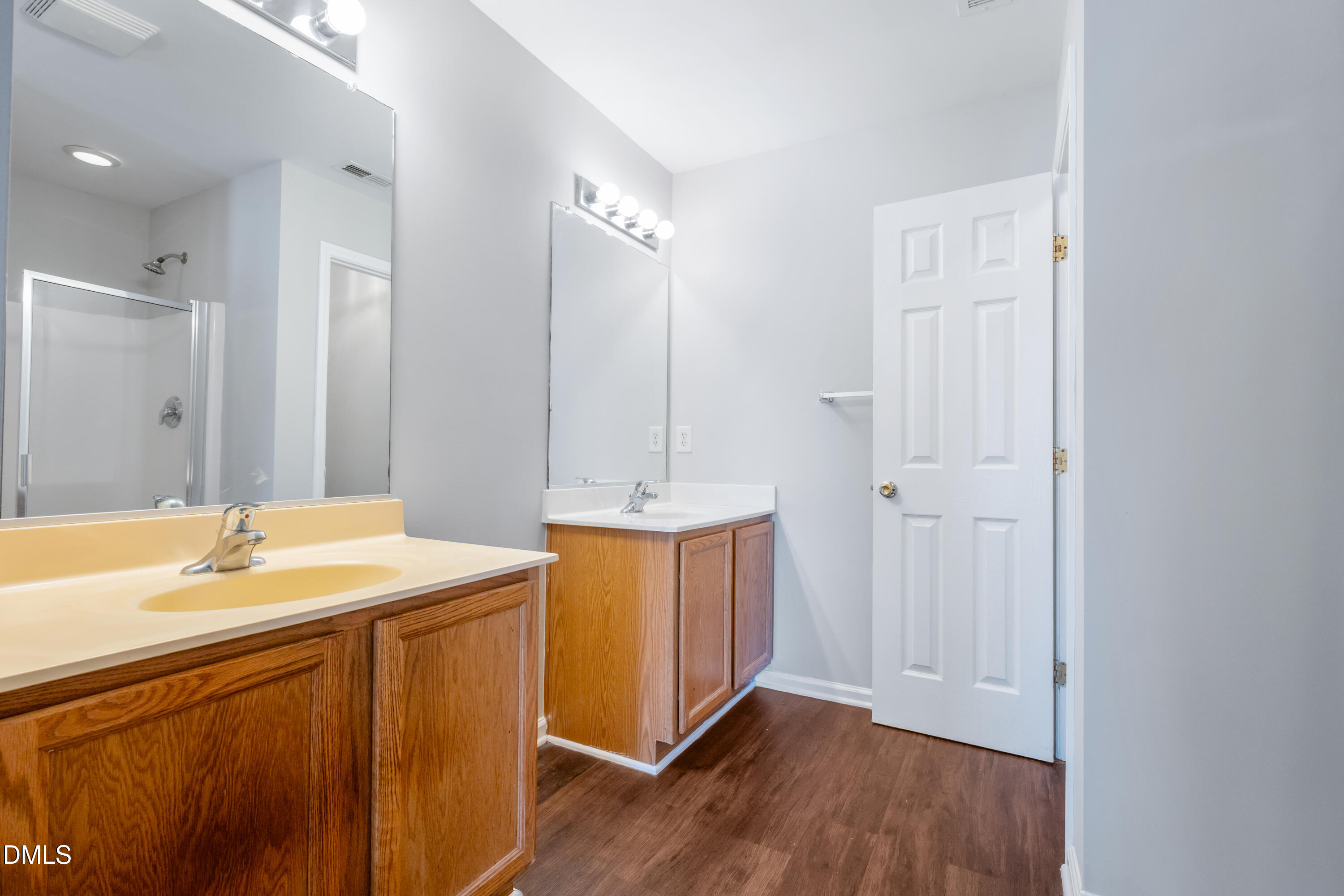 1532 Pebble Ridge Drive Raleigh, NC 27610 - Photo 29 of 40 a bathroom with a sink a mirror and a bathtub