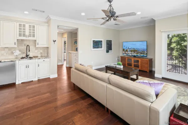 a bedroom with furniture and a wooden floor