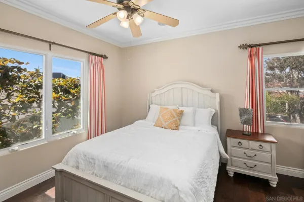 a spacious bedroom with a large bed and a fireplace