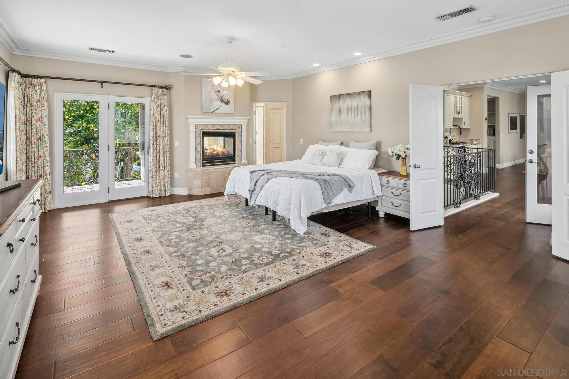 1100 Pine Street Coronado, CA 92118 - Photo 30 of 57 a spacious bedroom with a large bed and a fireplace