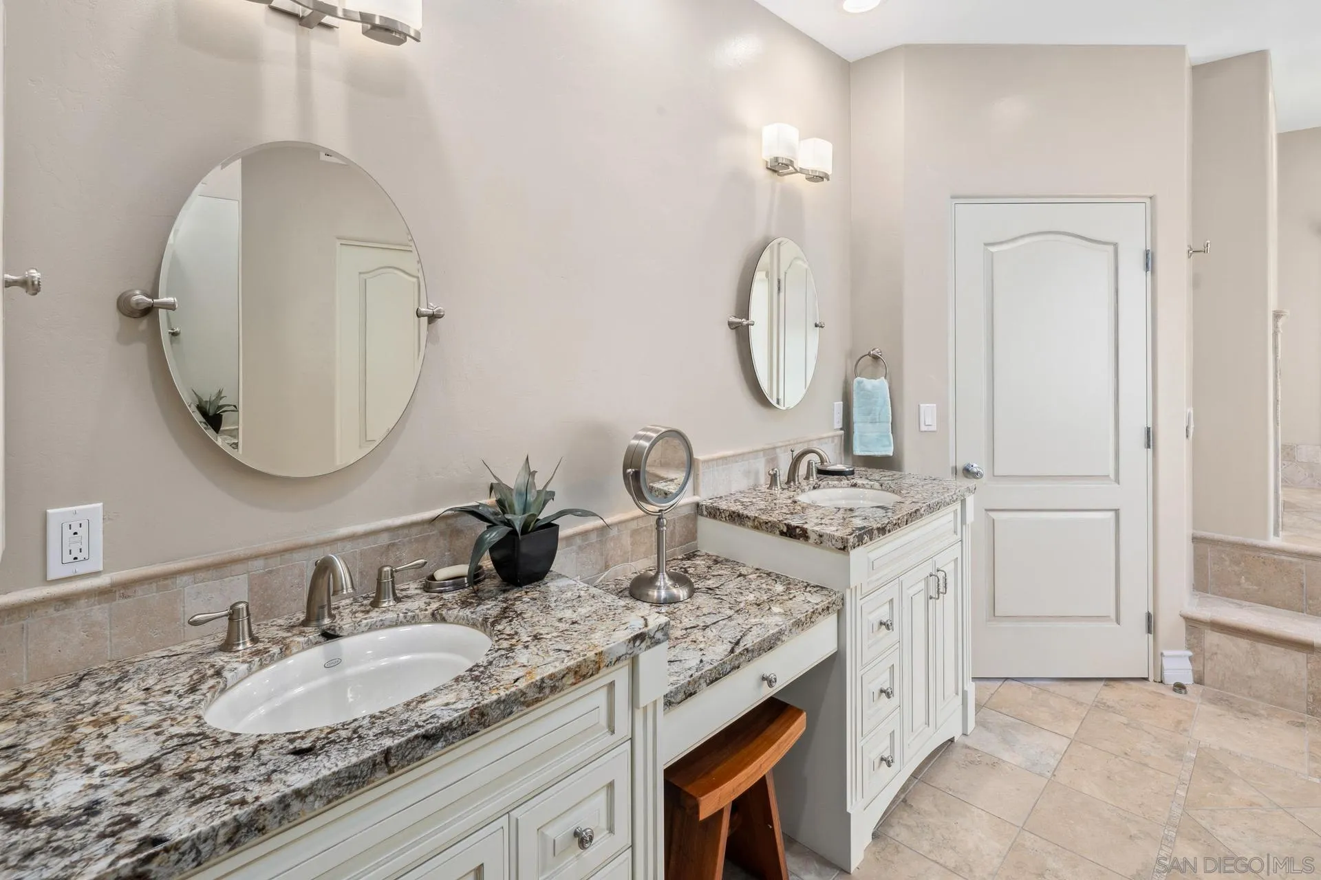 1100 Pine Street Coronado, CA 92118 - Photo 33 of 57 a bathroom with a granite countertop double vanity sinks and a mirror