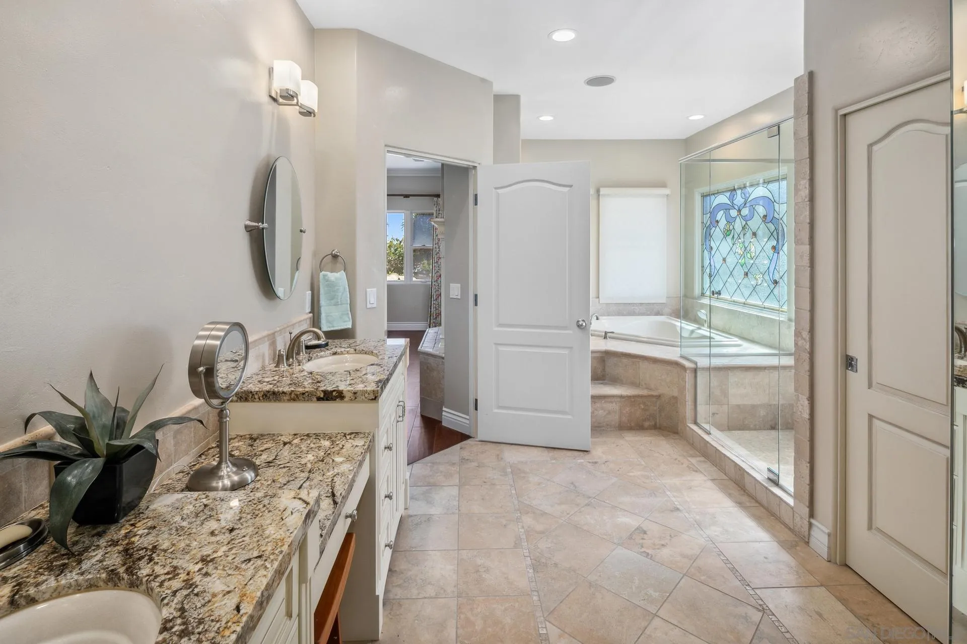 1100 Pine Street Coronado, CA 92118 - Photo 34 of 57 a bathroom with a granite countertop sink a mirror and shower