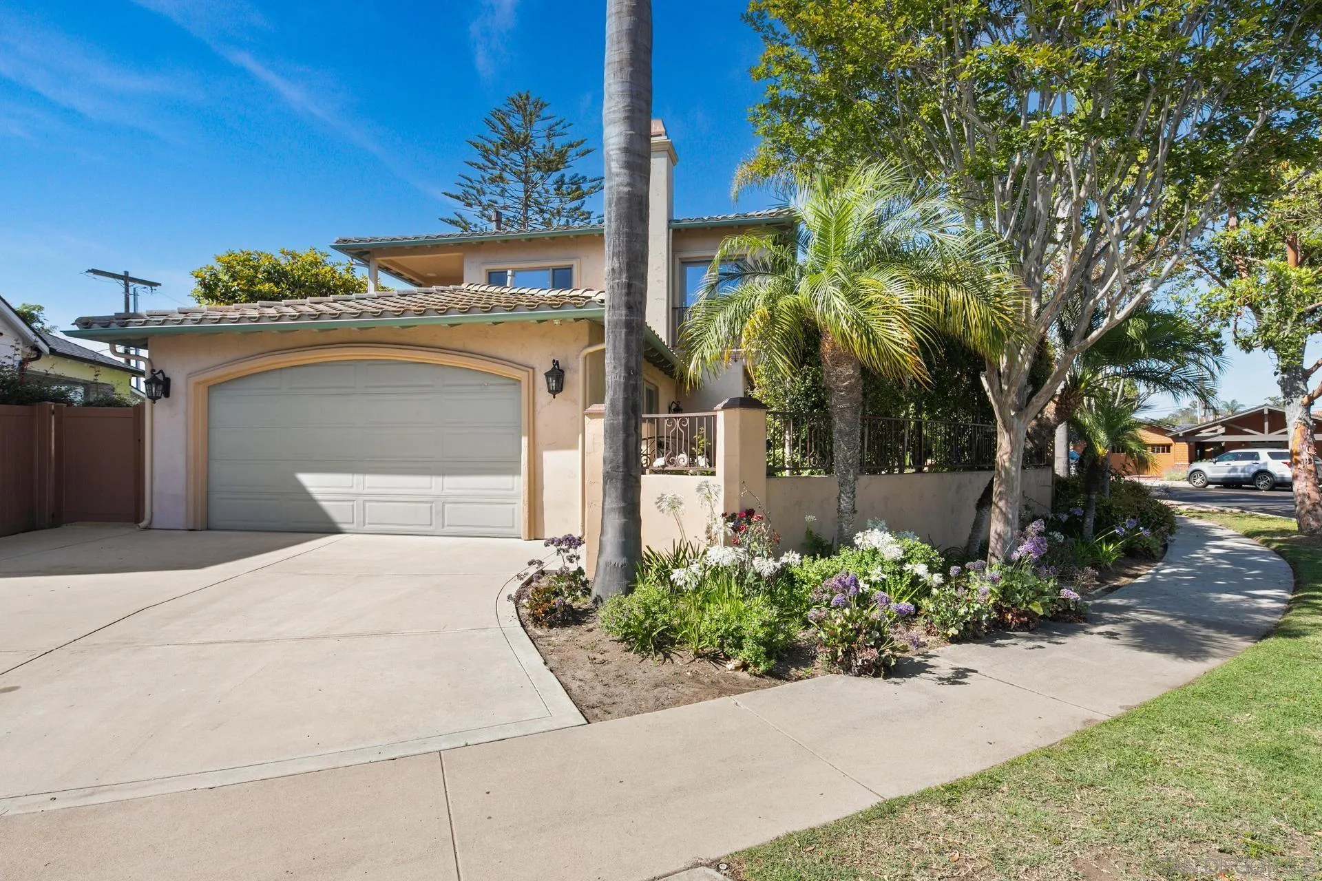 1100 Pine Street Coronado, CA 92118 - Photo 47 of 57 a front view of a house with a yard and garage