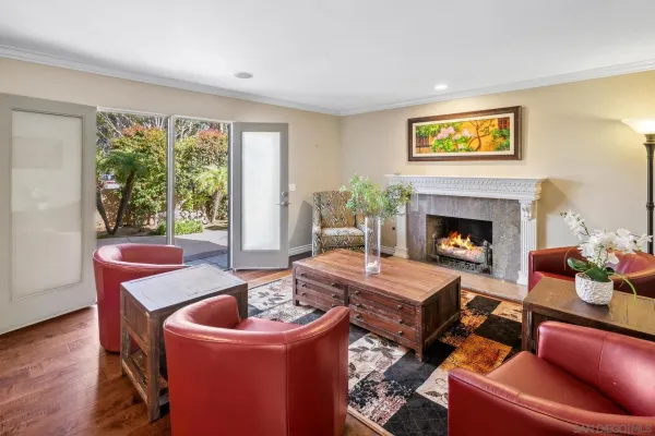 a living room with furniture and a fireplace