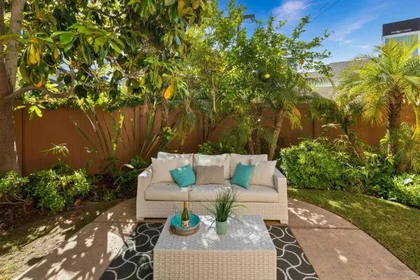 a view of table and chairs and potted plants