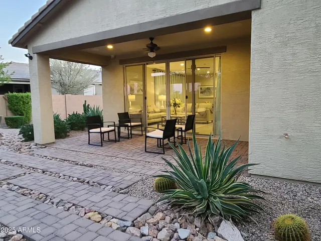a lobby with furniture and floor to ceiling window
