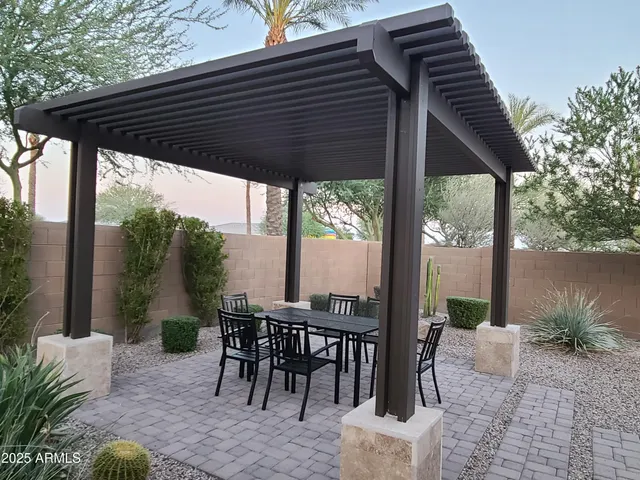 a patio with table and chairs