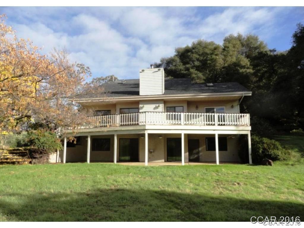 3965 Ranch Road Angels Camp, CA 95222 - Photo 1 of 1 a front view of a house with a garden