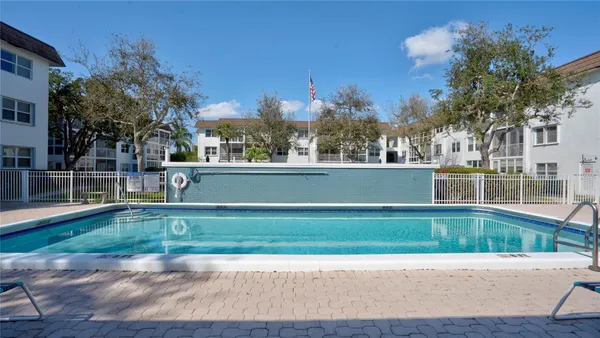 a view of swimming pool with a yard
