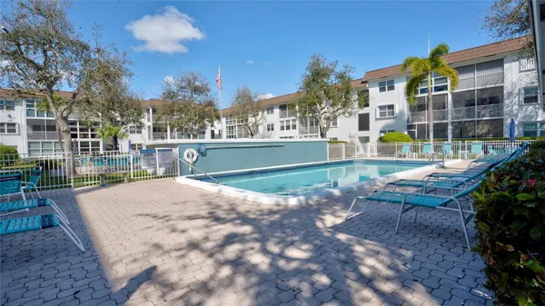 a view of a swimming pool with a patio