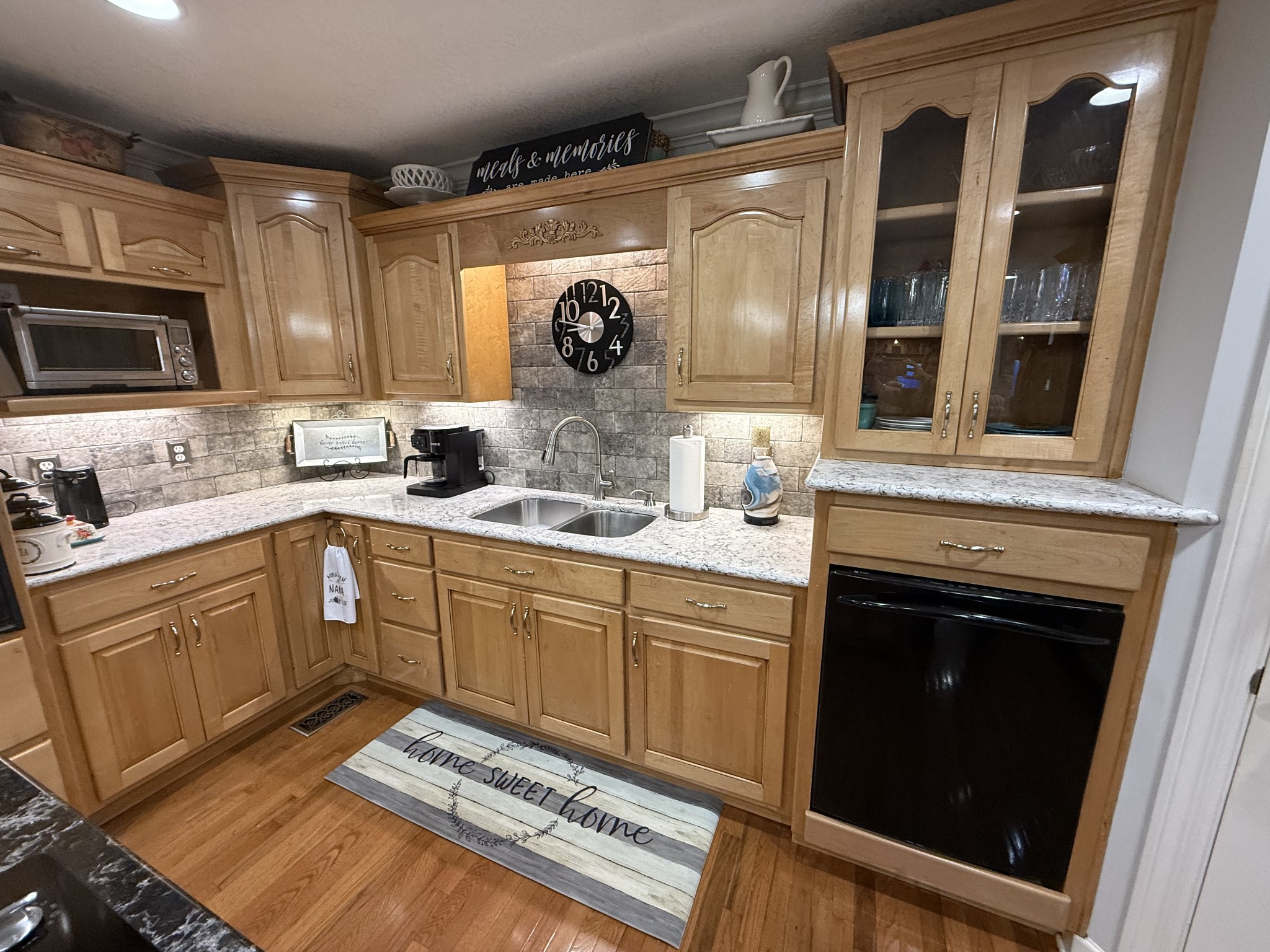 646 Indian Creek Road Huntland, TN 37345 - Photo 22 of 61 a kitchen with granite countertop a sink stove and microwave
