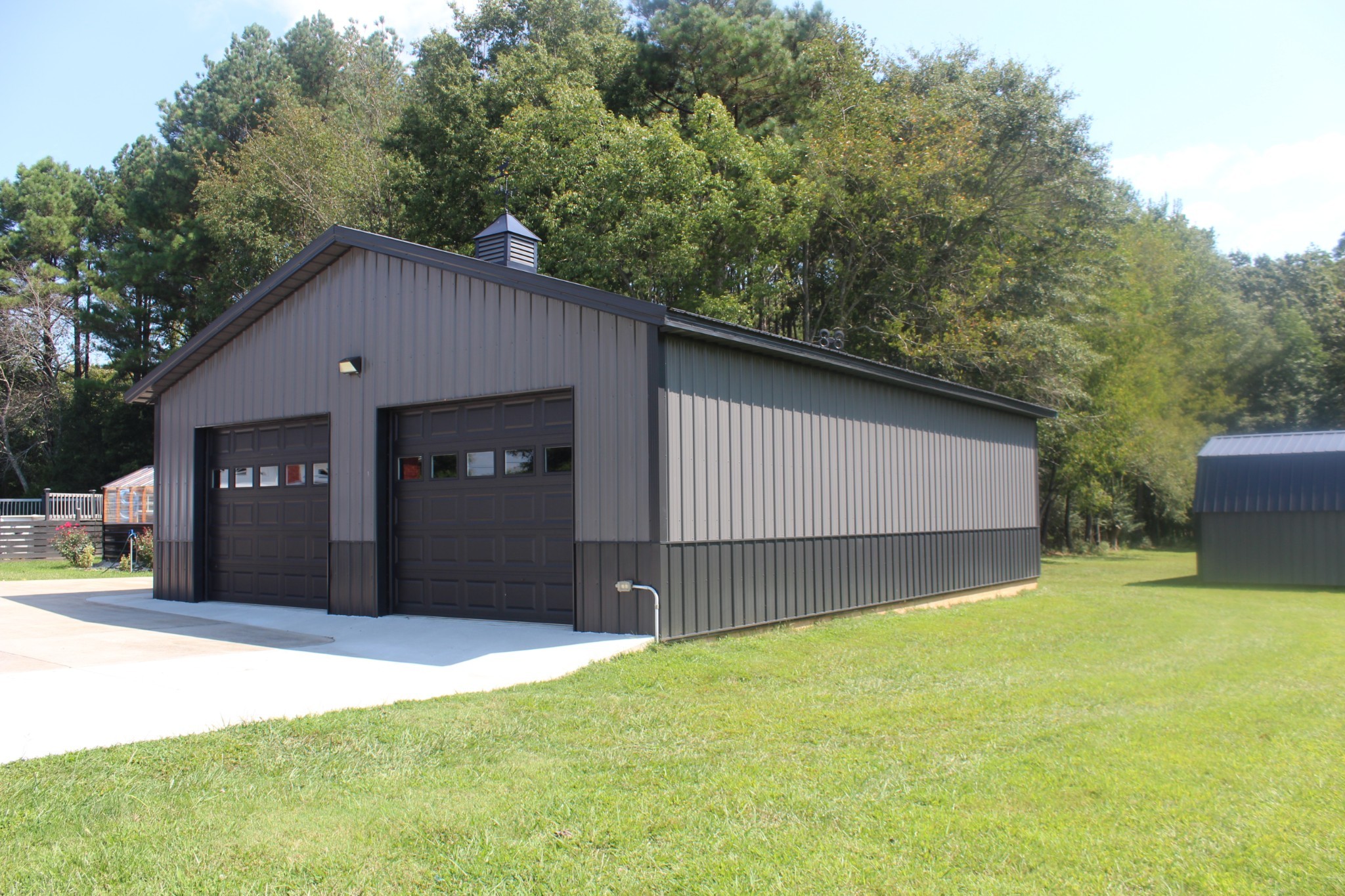 646 Indian Creek Road Huntland, TN 37345 - Photo 5 of 61 a front view of a house with a yard and garage