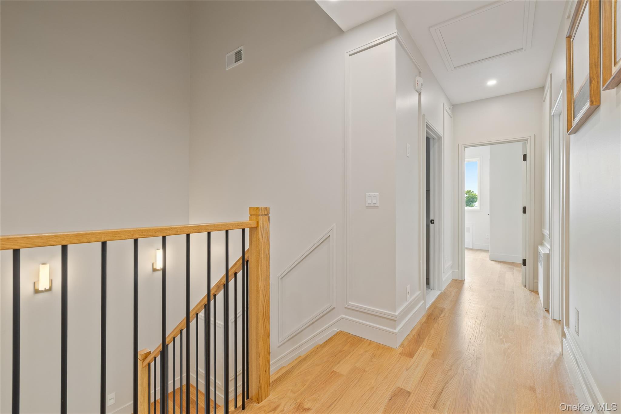 15 Ridge Avenue, Unit 204 Spring Valley, NY 10977 - Photo 17 of 41 a view of a hallway with wooden floor and staircase