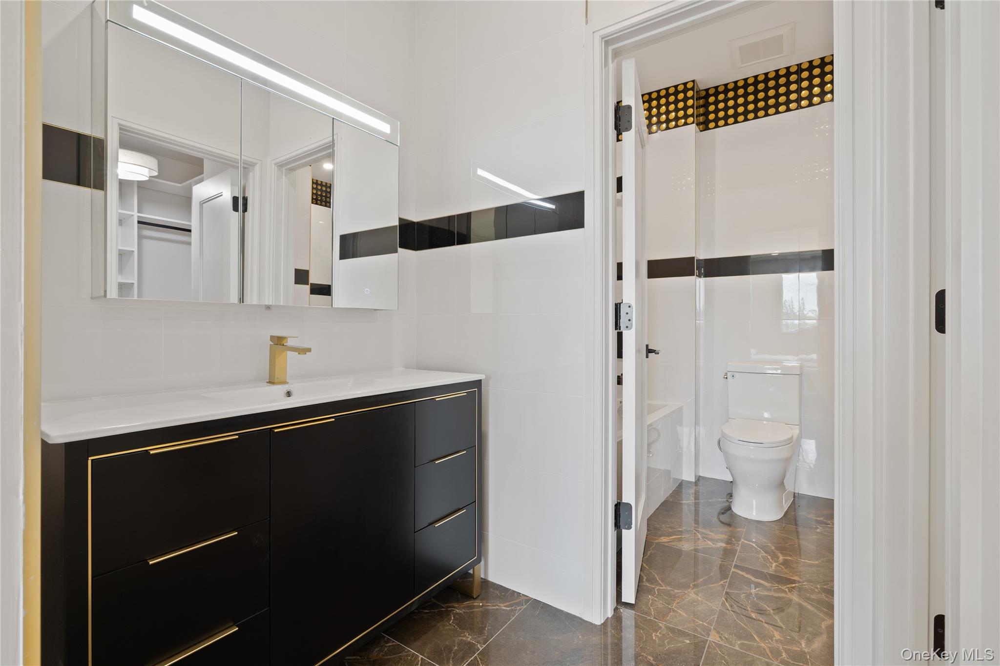 15 Ridge Avenue, Unit 204 Spring Valley, NY 10977 - Photo 19 of 41 a bathroom with a sink and a mirror