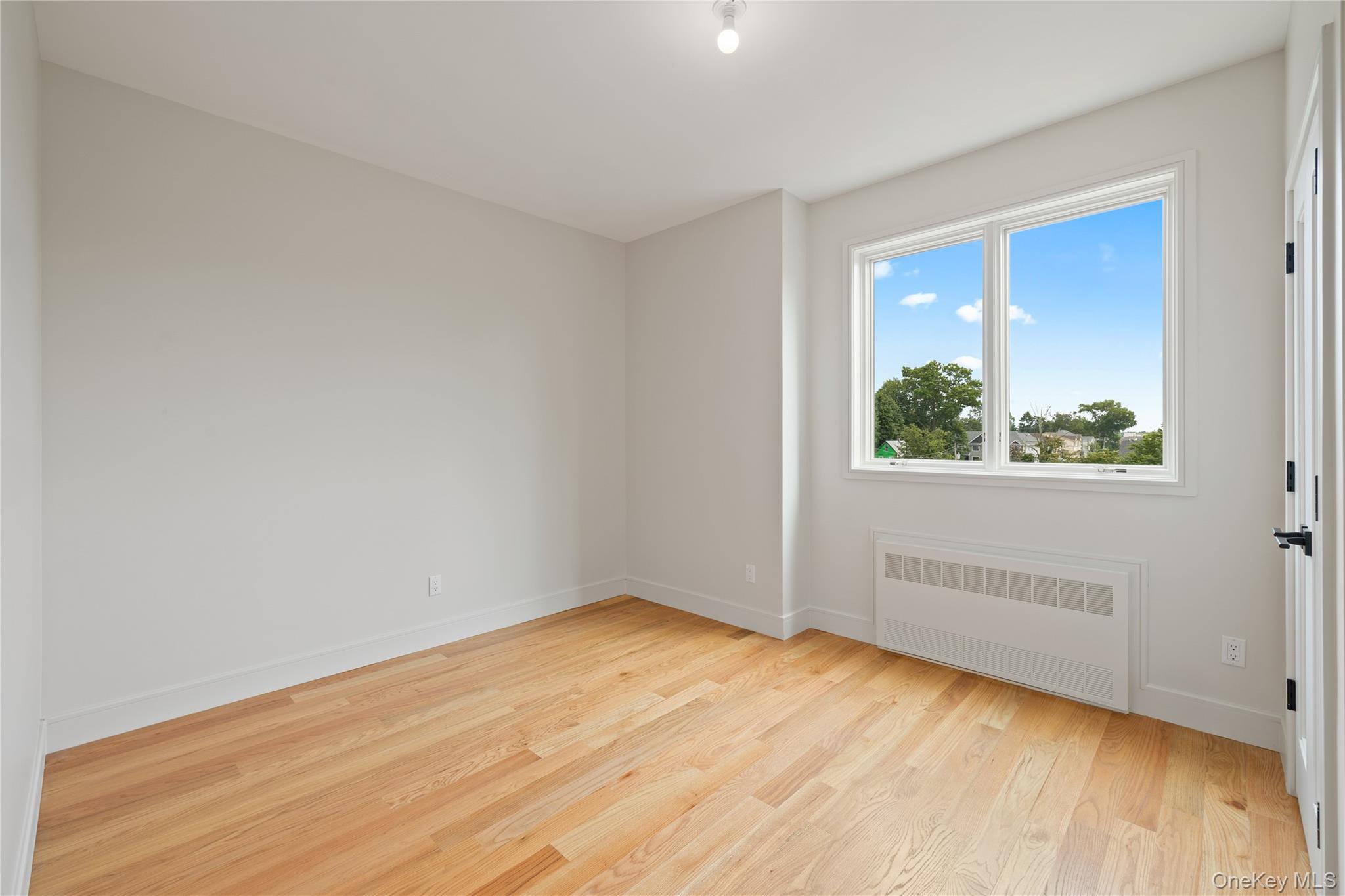 15 Ridge Avenue, Unit 204 Spring Valley, NY 10977 - Photo 22 of 41 an empty room with a window