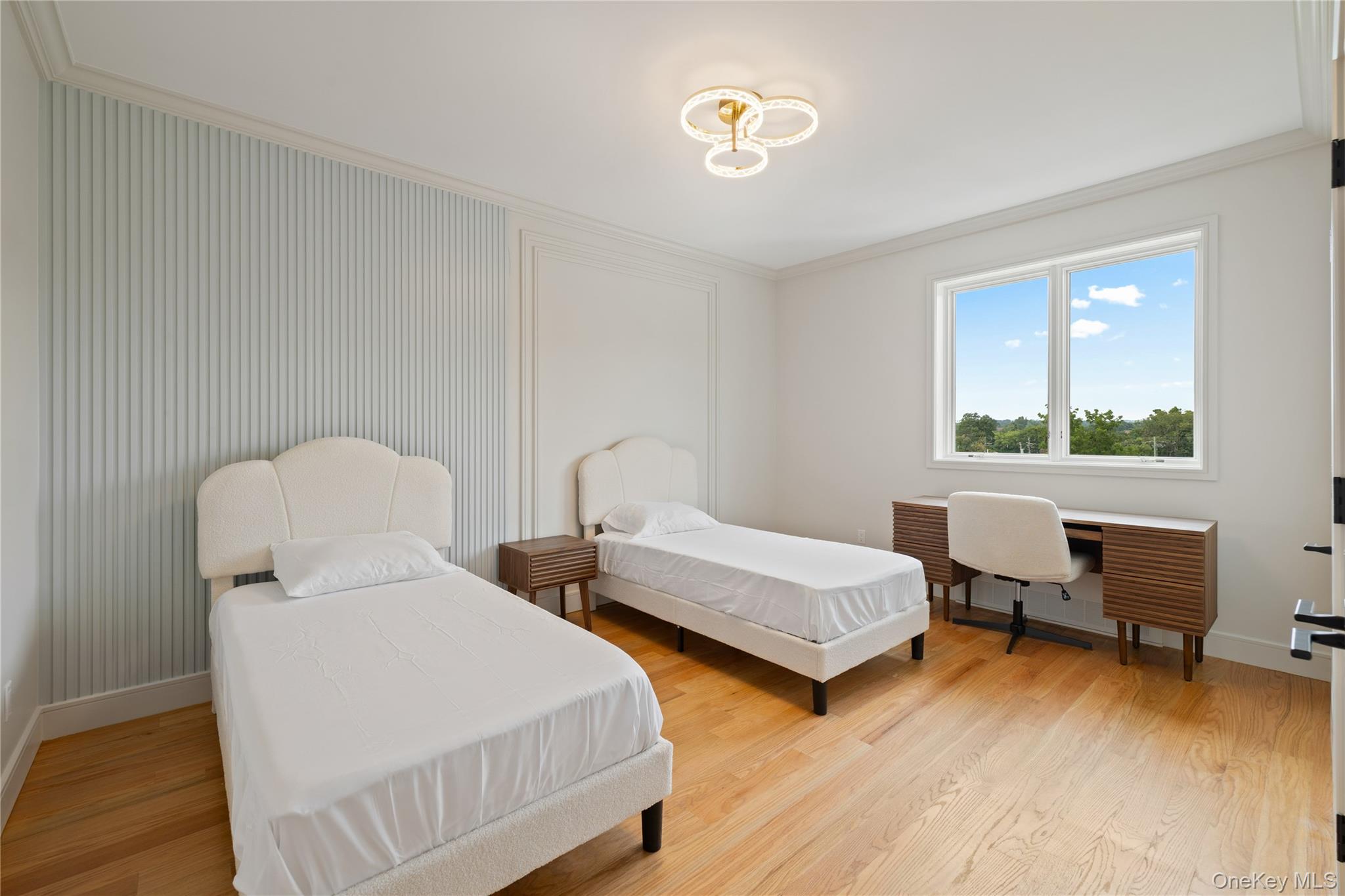 15 Ridge Avenue, Unit 204 Spring Valley, NY 10977 - Photo 26 of 41 a bedroom with two beds and a desk