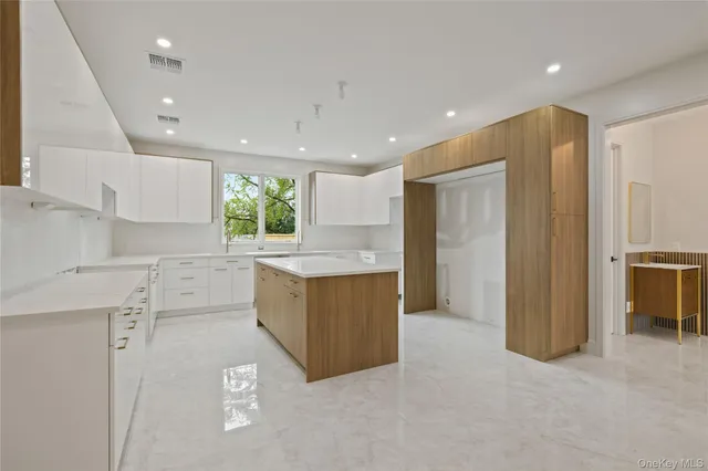 a kitchen with a refrigerator and window
