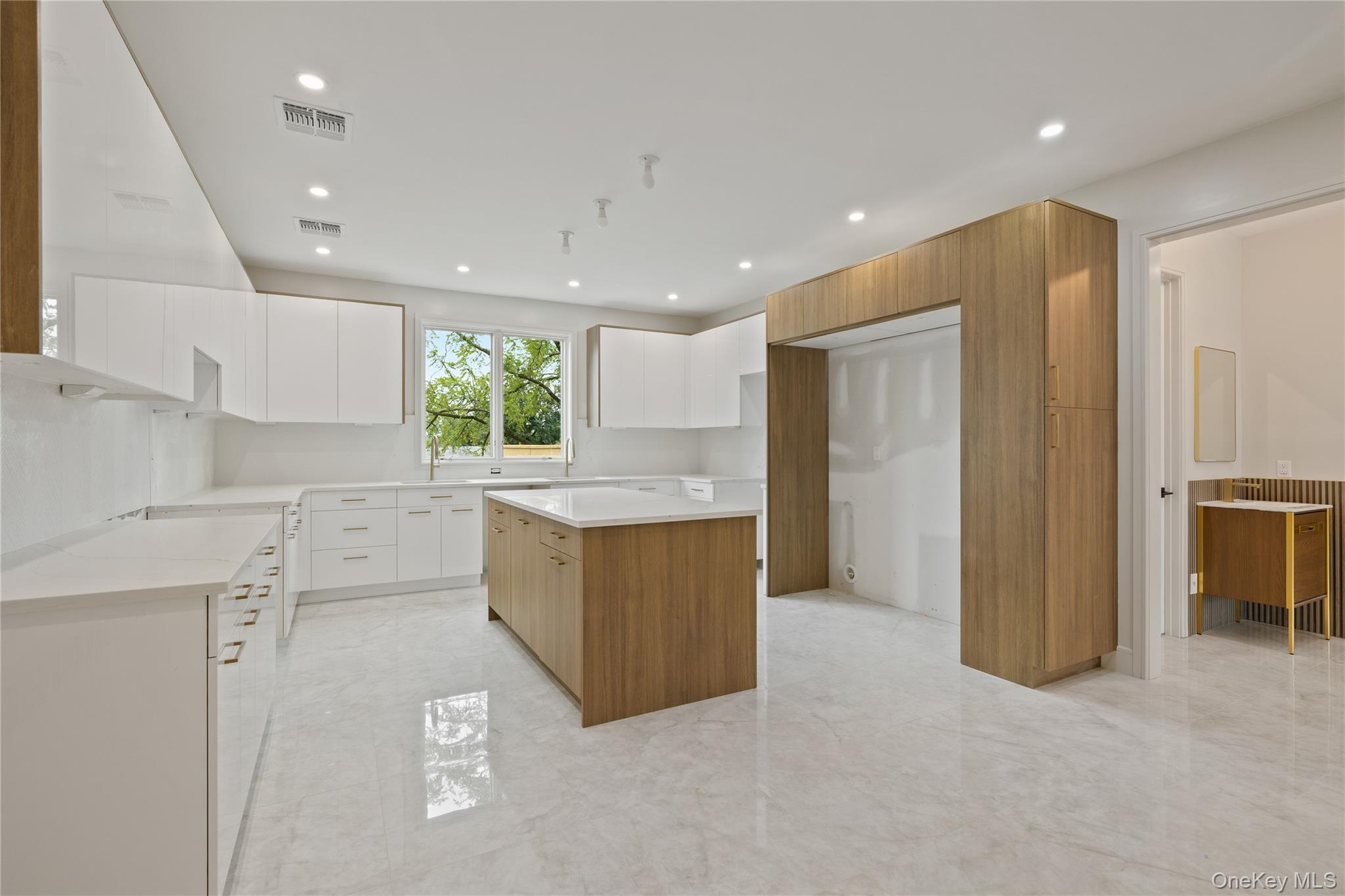 15 Ridge Avenue, Unit 204 Spring Valley, NY 10977 - Photo 31 of 41 a kitchen with a refrigerator and window