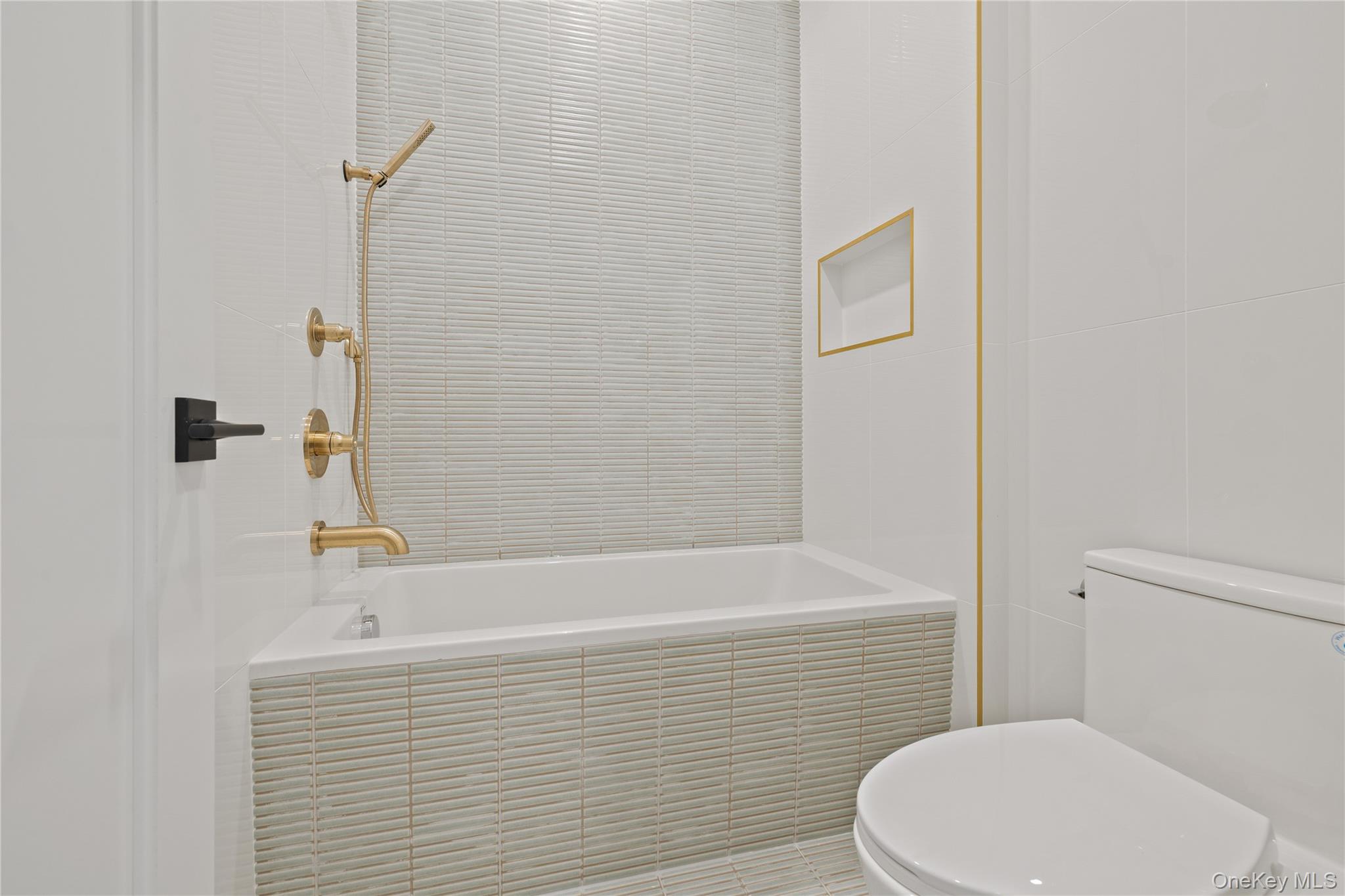 15 Ridge Avenue, Unit 204 Spring Valley, NY 10977 - Photo 38 of 41 a bathroom with a sink a toilet and shower