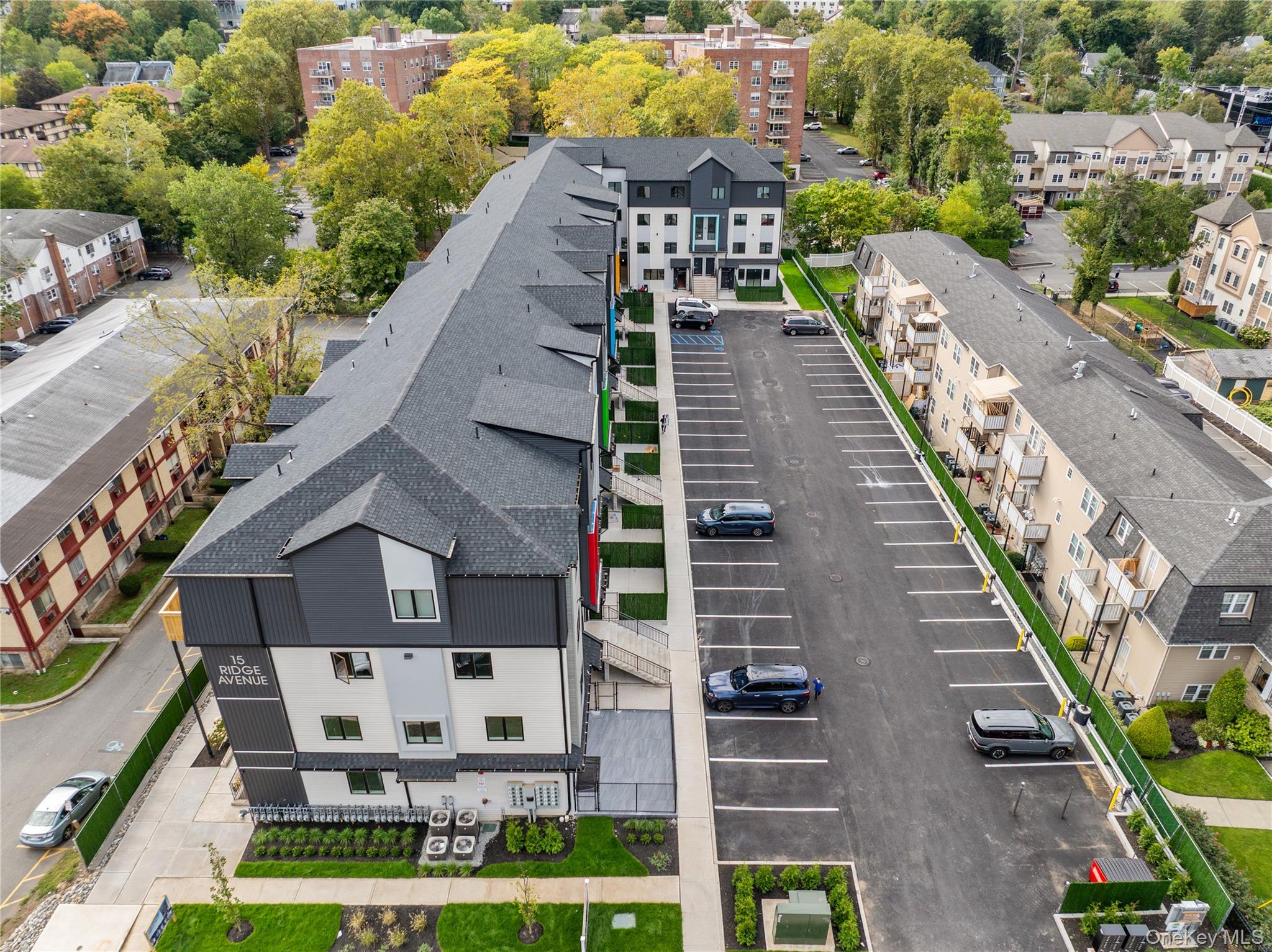 15 Ridge Avenue, Unit 204 Spring Valley, NY 10977 - Photo 40 of 41 a view of a city with tall buildings