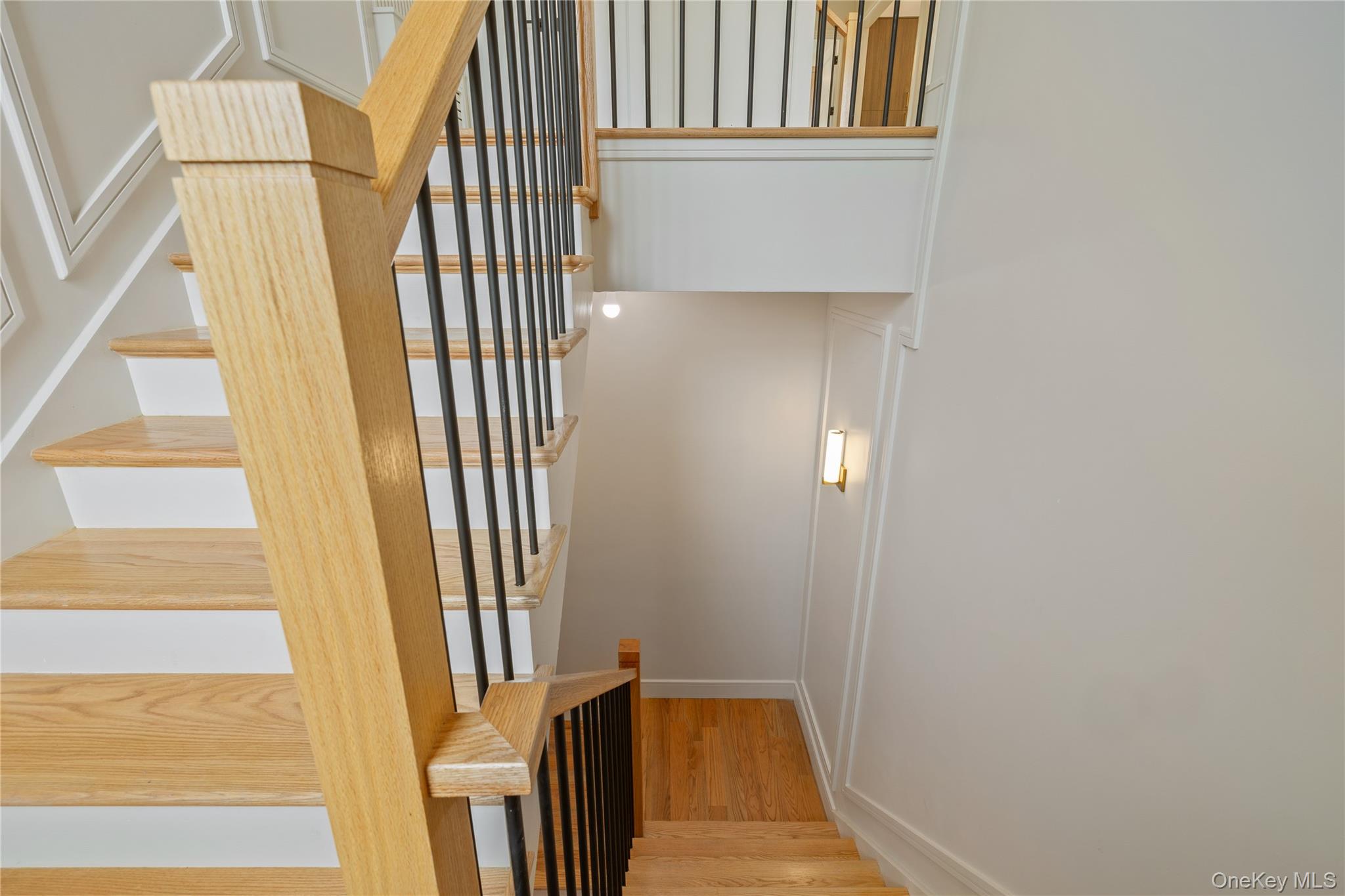 15 Ridge Avenue, Unit 204 Spring Valley, NY 10977 - Photo 4 of 41 a view of a hallway with wooden floor and staircase