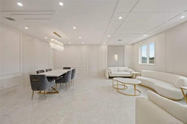 a living room with furniture and a table