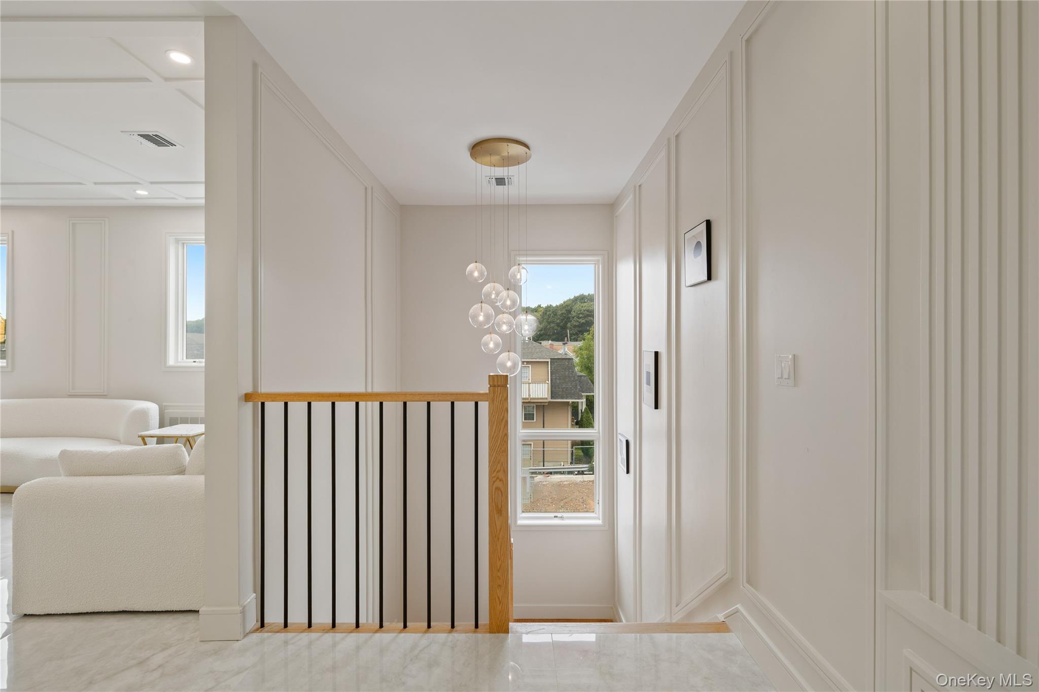 15 Ridge Avenue, Unit 204 Spring Valley, NY 10977 - Photo 9 of 41 a view of a hallway with windows and a couch