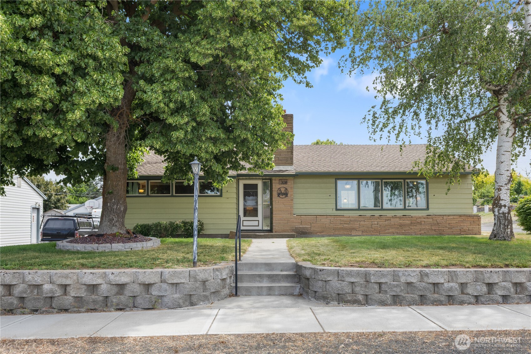308 North 2nd Street Harrington, WA 99134 - Photo 1 of 37 a front view of a house with garden