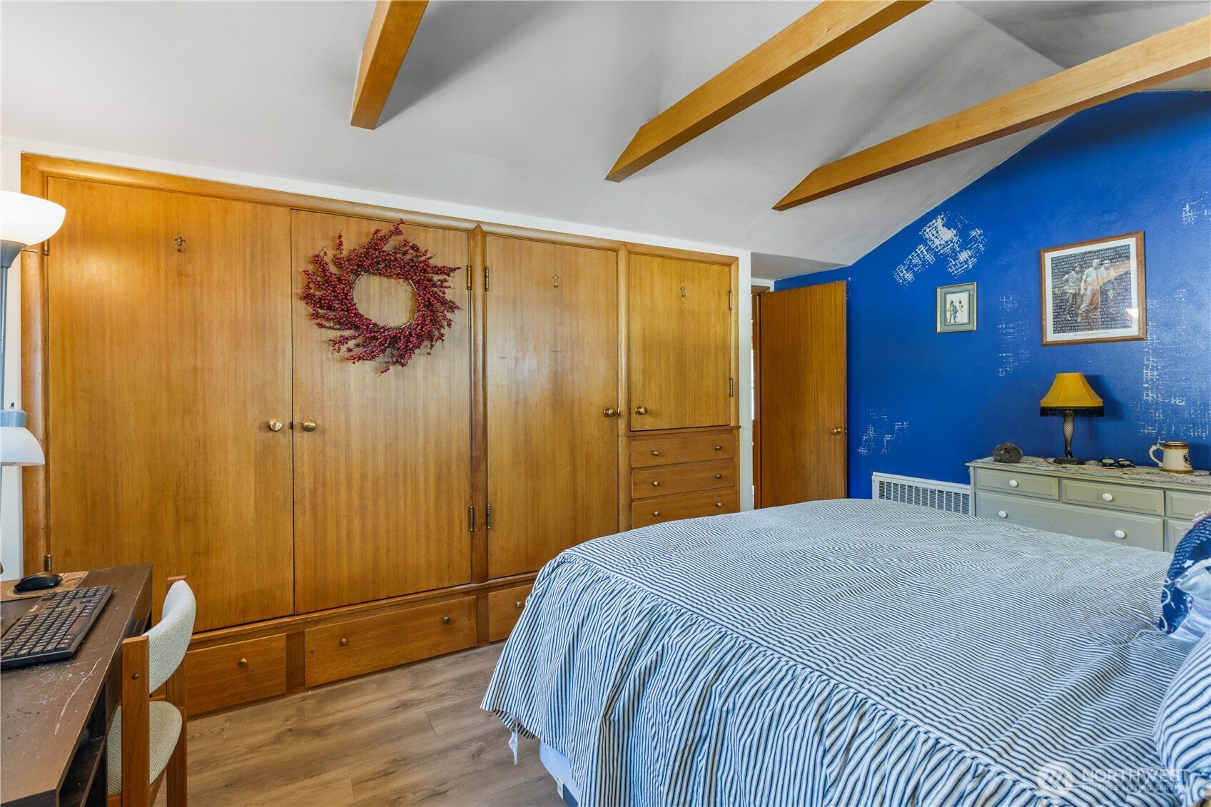 308 North 2nd Street Harrington, WA 99134 - Photo 18 of 37 a bedroom with a bed and a chandelier